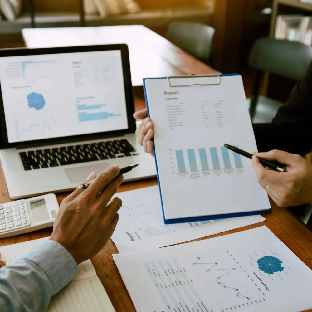 two-business-partnership-coworkers-analysis-strategy-with-discussing-a-financial-planning-graph-and two-business-partnership-coworkers-analysis-strategy-with-discussing-a-financial-planning-graph-and